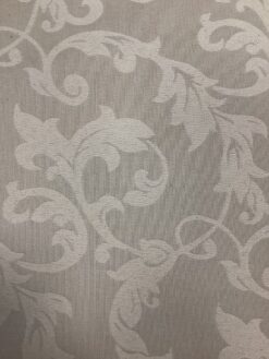 Tessuto damascato motivo panna su fondo tortora