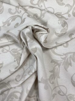 Tessuto damascato motivo tortora su fondo panna