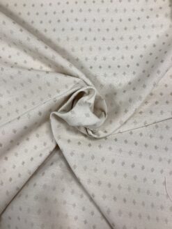 Tessuto rombi tortora su fondo panna