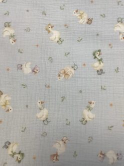 Mussola in cotone con  stampa papere fondo azzurro